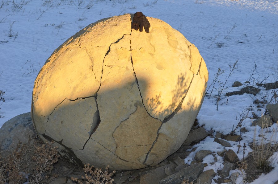 spherical rock, about 3 feet in diameter